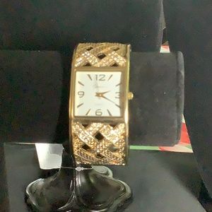 Grunion bracelet watch. Gold tone